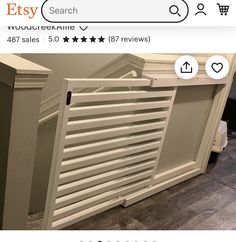 a white radiator sitting on top of a wooden floor next to a wall