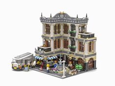 a lego model of a building with people standing in front and on the street outside