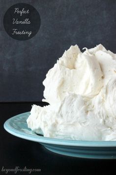 a blue plate topped with whipped cream on top of a table