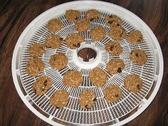 a white tray filled with cookies on top of a wooden table