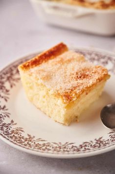 a piece of cake on a plate with a spoon