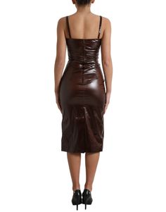 The Dolce & Gabbana Brown Shiny Silk Sheath Sleeveless Bodycon Midi Dress is a stunning addition to any wardrobe. This dress is brand new with tags and is 100% authentic, ensuring the highest quality and craftsmanship. The sleeveless design and bodycon fit create a sleek and sophisticated silhouette, perfect for any formal occasion. The dress features a rich brown color and is made from a luxurious blend of 94% silk and 6% elastane, providing a comfortable and flattering fit. The zipper closure Dolce Gabbana Dress, Bodycon Midi Dress, Dolce E Gabbana, Bodycon Midi, Italian Luxury, Guess Jeans, Midi Dress Bodycon, Dolce & Gabbana, Emporio Armani