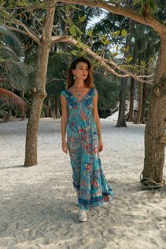 Bohemian Maxi Ruffles Dress, Elasticated Under The Chest For Perfect Fitted Look. This Elegant Flowing Dress is Light and Does Not Wrinkle, It is Made of Polyester. Its Touch is Soft Like Silk But It Is Much Easier to Care. Fluid, Light and Comfortable Fabric with Colorful Prints, Making It  The Ideal Summer Dress For The Beach, a Party or When Traveling. Free Size from s to xl Main Color: Light Blue Printing Color: Blue, Red  100% Polyester Machine wash 30o No Dryer HandMade Delivered In A Clot V-neck Boho Dress With Ruffles For Festival, Hippie Blue V-neck Dress, Flowy Turquoise Boho Print Dress, Turquoise Boho Print Dress For Beach, Beach Sundress With Paisley Print And V-neck, Turquoise Boho Print Beach Dress, Turquoise Bohemian Printed Dress, Bohemian Sleeveless Turquoise Dress, Turquoise Sleeveless Bohemian Dress