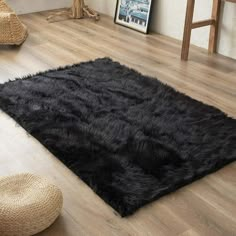 a black rug on the floor in a living room