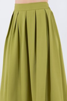 Vintage vibes with our box pleats midi skirts. Wear yours with a graphic t-shirt and sneakers, or dress it up with a fitted top and heels. Make it your own style for any occasion. Fit is true to size. Waistband has back elastic for stretch. Fabric: 100% polyester. Green Skirt With Pleated Hem For Spring, Chic Green Midi Pleated Skirt, Green Pleated Skirt With Accordion Pleats For Summer, Green Accordion Pleats Skirt For Spring, Green Accordion Pleats Skirt For Summer, Chic Green Flowy Pleated Skirt, Green Pleated Hem Summer Skirt, Green Pleated Hem Skirt For Summer, Green Summer Skirt With Pleated Hem