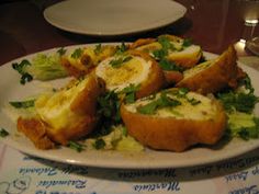 a white plate topped with bread and veggies