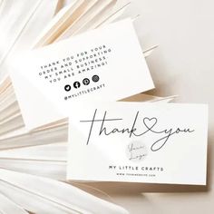 two business cards with thank you written on them