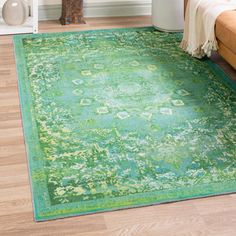 a green area rug in a living room