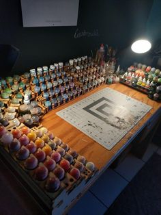 a table covered in lots of different types of cupcakes on top of it