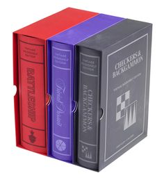 three books are stacked on top of each other in the shape of a book box