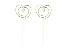 two heart shaped lollipops on top of each other with the word love spelled in