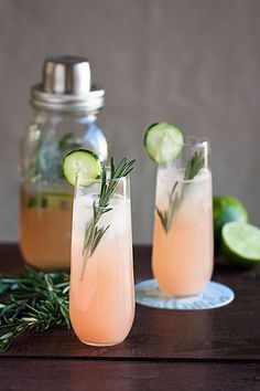 two glasses filled with gin and cucumber drink