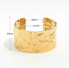 This trendy vintage cuff will dazzle any wardrobe. Whether on a beach trip or a night out with friends, this alluring cuff will sure be noticed by all. Pair with any HOJM ring or earrings for a luxurious look. Size: Adjustable cuff Material: Gold plated over Stainless Steel base . Tarnish and Water Resistant Allergies: Hypoallergenic Chic Metal Cuff Bangle Bracelet, Chic Metal Bangle Cuff Bracelet, Luxury Summer Party Jewelry, Elegant Metal Bracelets For Beach, Chic Cuff Bracelets For Party, Chic Cuff Bracelet For Party, Adjustable Open Cuff Jewelry For Party, Summer Gift Cuff Bangle Bracelet, Summer Gift Cuff Bracelet Bangle