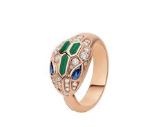 an 18k rose gold ring with diamonds and emeralds