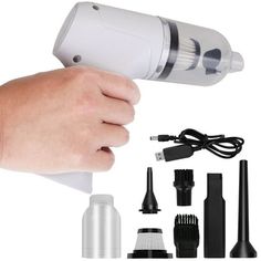 a hand is holding a hair dryer and other accessories