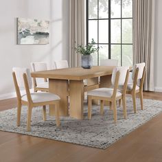 Modern Elegance with the Dahlia Dining SetThe Dahlia Seven-Piece Dining Set is a perfect blend of sleek lines and modern elegance, offering a simple yet sophisticated silhouette. The centerpiece is a beautifully crafted table with a poplar-veneered top and a bold split-slab leg design that exudes a modern, organic look. This set effortlessly transforms your dining area with its refined design and quality craftsmanship.Comfortable and Stylish Dining ChairsAccompanying the table are six dining chairs that feature matching wood bases and split-back designs. These elements contribute to enhancing the natural feel of your space. The chairs are not just aesthetically pleasing, but also highly functional with performance fabric upholstery that is both stain and liquid-resistant. This ensures dura Black Chairs Wood Table, Light Oak Dining Table, Modern Farmhouse Dining Table, Large Dining Room Table, White Oak Table, Dining Room Table Sets, Modern Dining Table Set, Black Chairs, Modern Farmhouse Dining