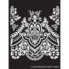 a black and white paper cutout with an ornate design on it's side