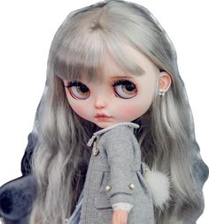 a close up of a doll with grey hair and big blue eyes wearing a gray jacket