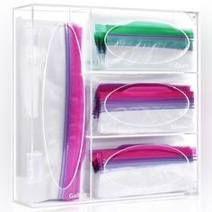 a clear plastic storage box filled with lots of different colored items