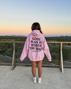 Step into bold faith with our "God's Plan is Worth the Wait Bible Verse" Sweatshirt from Made in Faith Apparel. More than just a garment, it's a declaration of patience, trust, and unwavering belief in the divine plan. 🌟 Product Highlights: Composition: Crafted from a blend of 50% Cotton and 50% Polyester, this sweatshirt combines comfort and durability in one divine package. Features: Enjoy the luxury of pre-shrunk fleece knit for lasting softness, side-seamed construction for a flattering fit, and the convenience of a tear-away label. Fit: The unisex cut with fitted sleeves ensures a stylish and comfortable silhouette for believers of all sizes. Wash & Care: Maintain the integrity of your faith-inspired sweatshirt effortlessly with easy-care instructions - machine wash cold and tumble d Cute Christian Hoodies, Christian Hoodie Design, Cute Christian Sweatshirts, Cute Hoodies For Teens, Do All Things In Love, Christian Fits, Bold Faith, Faith Apparel, School Spirit Wear