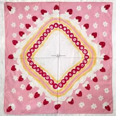 a pink and yellow square with hearts on it