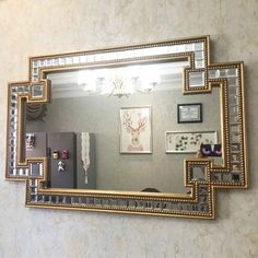 a mirror that is hanging on the wall