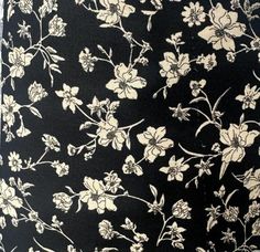 a black and white flowered skirt with flowers on it