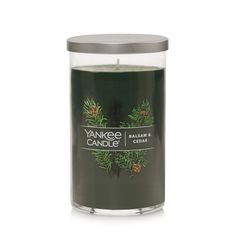 yankee candle with pine and cedar in a glass container on a white background, front view