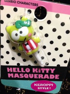 the hello kitty masquerade keychain is on display