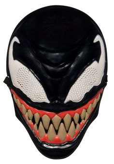 an alien mask with teeth and fangs on it