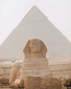 the great sphinx in front of the pyramids at giza