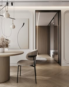 an elegant dining room with white walls and wood flooring is featured in this image