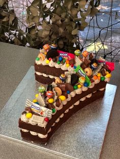 a chocolate cake with candy and candies on top