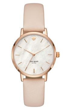 Elegant and classic, this versatile round watch features a lovely mother-of-pearl dial, slender hands and indexes, as well as a supple leather strap. 34mm case; 16mm band width Buckle closure Three-hand quartz movement Mineral crystal face Stainless steel with gold plate/leather/mother-of-pearl Imported Accessories Watches Women, Kate Spade Watch, Leather Strap Watch, Watches Unique, Gold Hands, Women Wrist Watch, Women's Watch, Diamond Watch, Classic Leather