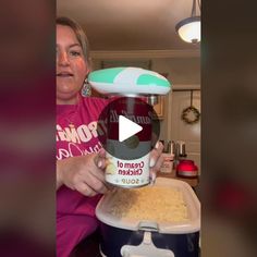 a woman is making macaroni and cheese in the crock pot with an ice cream container