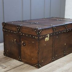 an old trunk is sitting on the floor