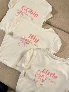 Super cute bow fam inspired sorority reveal baby tees Big Little Shorts, Sorority Jersey Shirts, Bow T-shirt, Country Big Little Reveal, Disney Big Little Reveal, Big And Little Themes, Big Little Themes Reveal, Sorority Apparel Ideas, Big Lil Reveal Themes