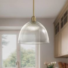 an image of a kitchen scene with focus on the pendant light