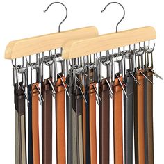 a rack with several pairs of belts hanging from it's hooks and wooden hangers