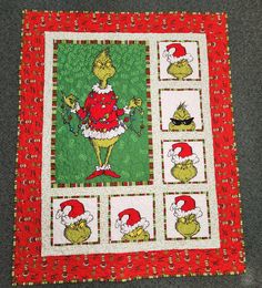 the grinch christmas quilt is on display