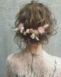 the instagram page shows an image of a woman with her hair in curls and flowers