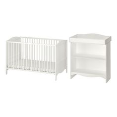 a white crib and bookcase next to each other