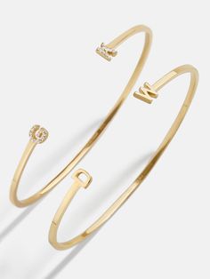 Our 18K Gold Double Initial Custom Cuff Bracelet is an updated take on a classic initial accessory. Available in an all-gold and a subtle sparkly version, these bracelets are ones you'll have for years to come. Add your own initials or that of you and a loved one to create a keepsake you'll cherish. Not to mention, thi Bubble Bar Bracelet, Initials Bracelet, Nameplate Necklace Gold, Nameplate Bracelet, Custom Cuff Bracelet, Gold Medallion Necklace, Ups Shipping, 18k Gold Earrings, Gold Bead Bracelets