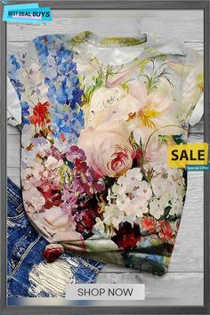 a shirt with flowers on it and the sale tag in front of it is shown