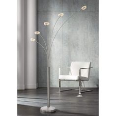 a modern floor lamp with five flowers on it