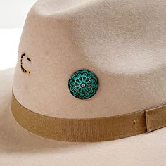 Patina, circle concho with detailed engraving and a small, center AB crystal hat pin. This hat pin is pictured on a beige hat and white background. Hat Bands, Giddy Up Glamour, Hat Pin, Hat Band, Hat Pins, Sale Items, Trucker Hat, Patina, Baseball Hats