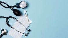 a medical stethoscope, measuring spoon and napkin on a blue background