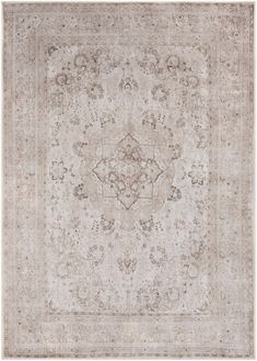 an antique rug with many different colors and patterns on the carpet, including beiges and browns