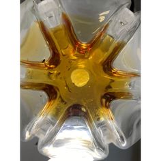 a close up view of a yellow glass object