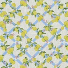 a yellow and blue checkered fabric with lemons on the front, green leaves and pink flowers